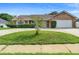 Charming one-story brick home with a manicured lawn and driveway at 40 Hollow Pine Dr, Debary, FL 32713