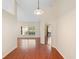 Inviting hallway featuring wood floors and natural light streaming through the window in the background at 40 Hollow Pine Dr, Debary, FL 32713