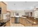 Kitchen with granite countertops, tile flooring, and modern appliances at 40 Hollow Pine Dr, Debary, FL 32713