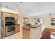 Kitchen with stainless steel appliances, granite countertops, and tile flooring at 40 Hollow Pine Dr, Debary, FL 32713