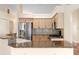 Bright kitchen featuring stainless steel appliances, granite countertops, and light wood cabinetry at 40 Hollow Pine Dr, Debary, FL 32713