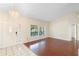 Bright living room featuring tile and hardwood floors at 40 Hollow Pine Dr, Debary, FL 32713