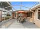 Covered patio featuring an outdoor dining set, seating area, and access to the backyard at 40 Hollow Pine Dr, Debary, FL 32713