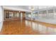 Large sunroom with brick accents, white walls and ceiling, with ceramic tile floors at 40 Hollow Pine Dr, Debary, FL 32713