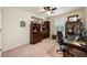 Bedroom featuring work space with dark wood furniture, ceiling fan and shutters at 411 Evening Sky Dr, Oviedo, FL 32765