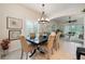 Inviting dining room with arched doorways and views of the living room at 411 Evening Sky Dr, Oviedo, FL 32765