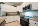 Modern kitchen boasting granite countertops and stainless steel appliances for an updated look at 411 Evening Sky Dr, Oviedo, FL 32765