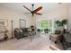 Comfortable living room with ceiling fan, shutters, and views of a private backyard at 411 Evening Sky Dr, Oviedo, FL 32765