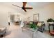 Cozy living room with plush seating, ceiling fan, and archway to dining area at 411 Evening Sky Dr, Oviedo, FL 32765
