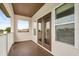 A private balcony with brown trim and white railing offers a view of the outdoors at 4221 Isle Vista Ave, Belle Isle, FL 32812