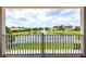 A balcony view overlooks a serene lake with a fountain, offering a peaceful outdoor retreat at 4221 Isle Vista Ave, Belle Isle, FL 32812