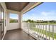 Enjoy a waterfront view from this covered balcony overlooking a tranquil lake at 4221 Isle Vista Ave, Belle Isle, FL 32812