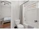 Bathroom and bedroom featuring a combination shower and tub at 4221 Isle Vista Ave, Belle Isle, FL 32812