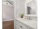 Bathroom vanity featuring granite countertops and white cabinets at 4221 Isle Vista Ave, Belle Isle, FL 32812