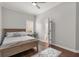 Bedroom with wood floors and ensuite bathroom at 4221 Isle Vista Ave, Belle Isle, FL 32812