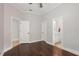Open bedroom with hardwood floors and ensuite bathroom access at 4221 Isle Vista Ave, Belle Isle, FL 32812