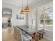 Charming dining room with modern table, pendant lighting, and plantation shutters at 4221 Isle Vista Ave, Belle Isle, FL 32812