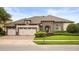 Beautiful single-story home with a three-car garage and well-maintained landscaping at 4221 Isle Vista Ave, Belle Isle, FL 32812