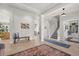 Bright foyer with tile flooring, decorative rug, and staircase leading to the second floor at 4221 Isle Vista Ave, Belle Isle, FL 32812