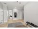 Hallway featuring neutral colors, modern lighting, and access to multiple rooms at 4221 Isle Vista Ave, Belle Isle, FL 32812