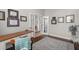 Bright home office with dark wood floors and natural light, promoting an ideal work environment at 4221 Isle Vista Ave, Belle Isle, FL 32812