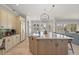 Kitchen island features light granite countertop with pendant lighting at 4221 Isle Vista Ave, Belle Isle, FL 32812