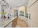 Gourmet kitchen with white cabinetry, granite countertops, and a central island with seating at 4221 Isle Vista Ave, Belle Isle, FL 32812