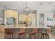 Spacious kitchen with a large island, light-colored cabinetry, and modern lighting fixtures at 4221 Isle Vista Ave, Belle Isle, FL 32812