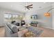 Comfortable living room with large windows, plantation shutters, and cozy seating arrangement at 4221 Isle Vista Ave, Belle Isle, FL 32812