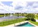 Stunning backyard view with a pool, pond, fountain, and lush landscaping creating a serene oasis at 4221 Isle Vista Ave, Belle Isle, FL 32812