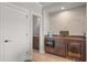 A wet bar with granite counters, tiled backsplash, microwave, and beverage fridge at 4221 Isle Vista Ave, Belle Isle, FL 32812