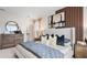 Bright and inviting bedroom featuring a stylish bed, and wood bedside tables at 4618 Linda Dr, Lake Wales, FL 33859
