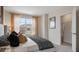 Well-lit bedroom with large window, curtains, and walk-in closet at 4618 Linda Dr, Lake Wales, FL 33859