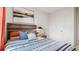 Comfortable bedroom featuring a stylish bed with decorative pillows and bedside table, plus neutral wall art at 4618 Linda Dr, Lake Wales, FL 33859