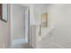 Hallway featuring carpeted stairs and walls with decorative art, offering a clean and neutral look at 4618 Linda Dr, Lake Wales, FL 33859