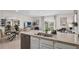 Bright, open-concept kitchen with granite counters, stainless steel appliances, and an adjacent dining area at 4618 Linda Dr, Lake Wales, FL 33859