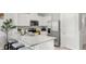 Modern kitchen with stainless steel appliances, granite countertops, and a breakfast bar at 4618 Linda Dr, Lake Wales, FL 33859