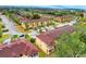 Beautiful aerial view of townhomes with well-maintained landscaping in a gated community at 487 La Mirage St, Davenport, FL 33897