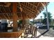 Poolside Tiki Bar with inviting chairs to sit and relax at 487 La Mirage St, Davenport, FL 33897