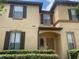 Inviting two-story home featuring charming architecture and well-manicured landscaping at 487 La Mirage St, Davenport, FL 33897