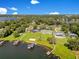 Breathtaking aerial perspective of luxurious lakeside residences, showcasing manicured lawns, private docks, and serene waterfront scenery at 49 Interlaken Rd, Orlando, FL 32804