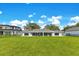 Expansive backyard with lush green lawn, offering ample space for recreation and outdoor activities. The property is fenced at 49 Interlaken Rd, Orlando, FL 32804