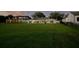 Expansive backyard with ample green space and patio at 49 Interlaken Rd, Orlando, FL 32804