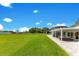 Expansive backyard and covered patio with views of the lake, ideal for outdoor entertaining at 49 Interlaken Rd, Orlando, FL 32804