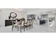 Dining area with large table, marble floors, and an open concept design next to the kitchen at 49 Interlaken Rd, Orlando, FL 32804