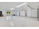 Spacious three car garage with windows, providing ample parking and storage, and a clean, organized space at 49 Interlaken Rd, Orlando, FL 32804