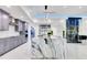 Elegant kitchen with gray cabinets, stainless appliances, and a large center island at 49 Interlaken Rd, Orlando, FL 32804