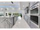 Modern kitchen with a large island, stainless steel appliances, and an open design at 49 Interlaken Rd, Orlando, FL 32804