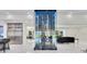 Modern kitchen features sleek stainless steel appliances and a glass wine rack that showcases the home's open floor plan at 49 Interlaken Rd, Orlando, FL 32804