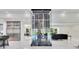Open concept living space includes a wine rack, marble flooring, and ample natural light at 49 Interlaken Rd, Orlando, FL 32804